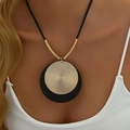 Women long layer necklace with golden woven disk pendant and black textured base - Black & Gold Round Disc