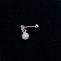 Macro view of silver stainless steel cartilage stud with clear gemstone and sphere pendant - Steel Color-Ball Dangle
