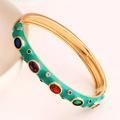 Detail of gold-plated bangle featuring green enamel and multi-color micro-set zircon stones - Green