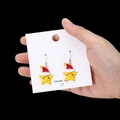 Christmas star earrings with smiley face and Santa hat on yellow enamel finish - Yellow Star Smile