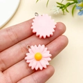 Pair of pink resin daisy charms with yellow center and metal loop for DIY jewelry - Pink