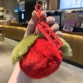 Detail of red plush apple keychain with green leaf and Chinese tag for peace and joy - Red Apple Peace And Joy