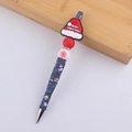 Detail of Christmas beaded pen featuring blue barrel, Santa hat bead, and red snowflakes - Christmas Hat