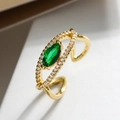 Macro detail of gold plated ring with marquise green zircon and side stone accents - Adjustable Open / Green (13497)