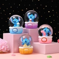 Cute Stitch cartoon crystal snow globe with macaron cupcake base for desk decoration - Di Baby Style (NO.67迪崽宝贝) / Small (45#) With Light And Snow