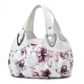Close-up of floral print handbag featuring white leather handles and silver hardware rivets - White Leather Pink Purple Floral (Style 11)