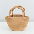 Handmade woven straw tote bag in warm brown featuring double top handles and bucket shape - Pure Khaki Twist Handle