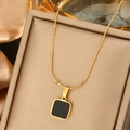Minimalist gold pearl beaded necklace with black square pendant on silk background - Black Square Minimalist Pendant