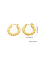 Detail of gold hoop earrings with vertical grooves and embossed X-shaped pattern - Gold Vertical Groove X Embossed Style (#0257)