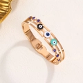 Brazalete dorado de tres capas con ojo turco de esmalte y circonitas azules - Oro rosa