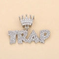 Macro shot of silver hip hop pendant featuring iced out TRAP letters and crown detail - Silver TRAP (Crown)