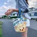 Canvas bucket bag in beige with blue straps and naughty bear print for casual DIY styling - Naughty Bear