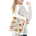 Close-up of white canvas tote bag featuring colorful botanical and mushroom prints - Hand-painted Mushroom Garden Print