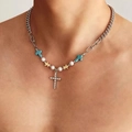 Silver chain necklace featuring green cross, golden butterfly, and pearl charms on model - Butterfly Beaded Cross Titanium Steel Necklace
