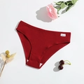 Close-up of ribbed cotton panties in deep red with high-quality stitching and brand tag - Burgundy
