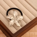 Polished silver floral metal hair tie with high elastic black band in French vintage style - Silver Lily Flower