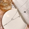 Silver love letter necklace with geometric pendants on white display plate - Alphabet / Steel