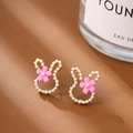 Sweet rabbit stud earrings with white pearls, pink flower, and gold plating for women - Pink