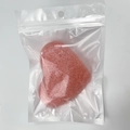 Pink heart-shaped konjac face sponge for gentle cleansing in a clear hanging pouch - Pink Heart