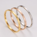 Detail of three-color greek key pattern metal bracelets in gold rose gold and silver - Silver + Gold + Rose Gold (4mm)