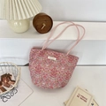 Close-up of pink floral canvas tote bag with Sosakka label on a white podium - Strawberry Bird