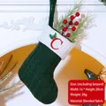 Green knit Christmas stocking with embroidered letter C and winter foliage details - Embroidered Knit Christmas Stocking-C