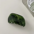 Top view of a dark green tortoiseshell acetate claw clip on a clean white background - Trapezoid