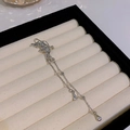 Silver bow butterfly tassel earrings with cascading chains and teardrop crystal drops - Left Ear Butterfly Hollow Drop Tassel (HSLE5310 Left)
