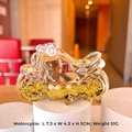 Close-up of crystal motorcycle keychain with golden sequins and size 7.3x4.3x5cm - Black & Gold