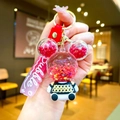 Cute Mickey-style floating liquid keychain with red glitter stars and pink Bubble strap - Red Sitting Bear with Gradient Rope