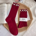 Red ribbed knit socks with pearl and rhinestone embellishments on wooden tray - One Size (EU 34-39) / Burgundy