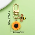Golden sunflower and honey bee keychain pendant accessory with pearl details and 5.3cm length - Sunflower Bee Combo B