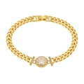 Detail of gold Cuban chain bracelet with large oval centerpiece and crystal accents - White