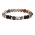 Detail of beaded bracelet featuring natural tiger eye and turquoise with gold spacers - India Agate
