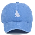 Detailed close-up of white dog silhouette embroidery on a blue washed cotton baseball cap - Light Blue