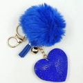 Detail of blue plush fur pompom with rhinestone heart charm and decorative tassel keychain - Royal Blue
