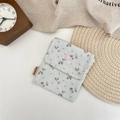Detail of floral canvas storage pouch featuring a pink button and blue fabric texture - L Blue