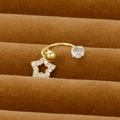 Detailed macro view of a gold star navel ring with sparkling zircon stone inlay - Star Pendant Style (Y20370-16)