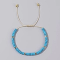 Ethnic beaded bracelet with sky blue turquoise stones and golden spacers on beige cord - Sky Blue Marble Beads-Cream Cord-Single Bracelet