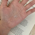Minimalist silver butterfly pendant necklace in a delicate metallic chain finish - Bowknot Pendant Necklace (XL3287)