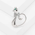 Silver cat ring with green gemstone eyes and a sparkling rhinestone bow detail - Silver