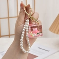 Pink liquid quicksand keychain with pig doll and pearl beads for bag decoration - Chain Style-Sugar Bathtub