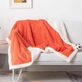 Close-up of orange striped flannel and white sherpa fleece blanket on sofa - Coral / 70*100CM