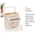 Close-up of white upright piano music box with realistic keys and golden pedal detail - Upright Piano with Dancing Girl