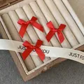 Set of three vibrant red satin ribbon bow hair clips in a premium wooden box - Red