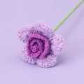Macro shot of handcrafted crochet purple rose with vibrant petals and green stem - Single-headed Barbie Rose Stem - Gradient Purple