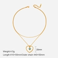 Double-layered gold necklace featuring a blue heart pendant and layered chain detail - Gold