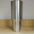 Silver 40oz stainless steel tumbler with handle and straw on a minimalist wooden table - Steel Body / 40oz