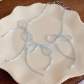 Light blue beaded butterfly knot necklace with adjustable metal extension chain - Blue Beaded