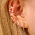 Gold multi-piece ear piercing set with star studs and zircon ear cuffs for women - Star Style (10487)
